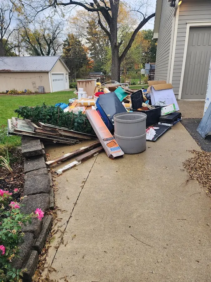 Dumpster being loaded with debris for 3 Yard Dumpster Rental in Kaufman